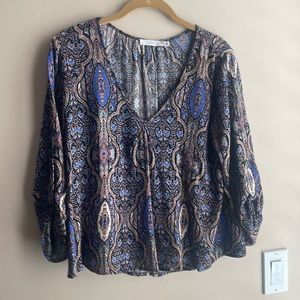 Loose below waist blouse.